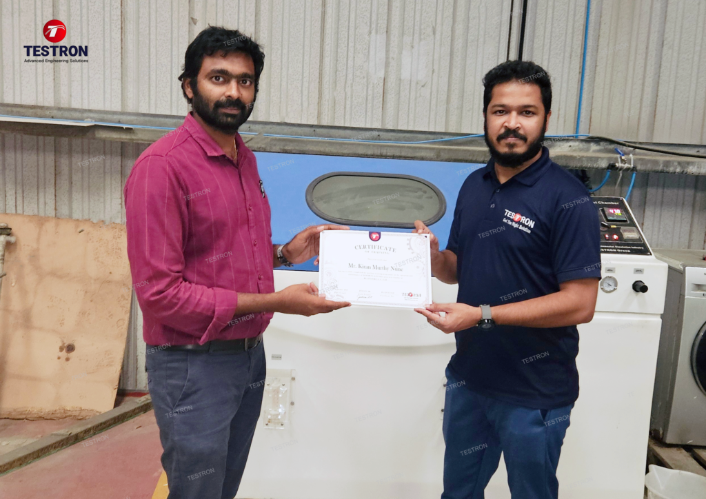 KLUDI RAK L.L.C. team receiving certificate for salt spray test equipment training