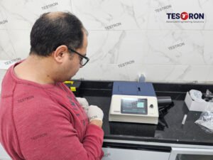 Technician operating TT-BGS6060 Benchtop Grating Spectrophotometer by Testron for accurate color measurement and quality control in laboratory